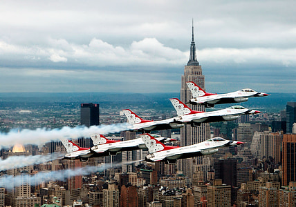 six white jet fighter performing stance in air thumbnail