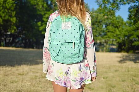 woman carrying blue bag thumbnail
