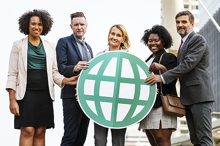 three women and two women holding globe logo thumbnail
