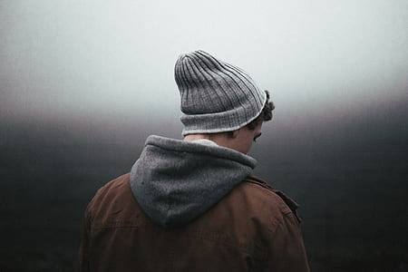 person wearing brown and gray hoodie and gray beanie thumbnail