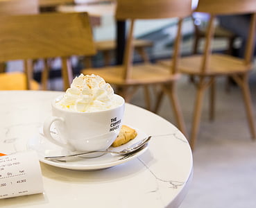 white ceramic cup filled with vanilla ice cream thumbnail