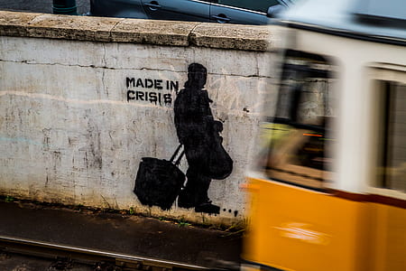 person carrying bag wall paint near vehicle thumbnail