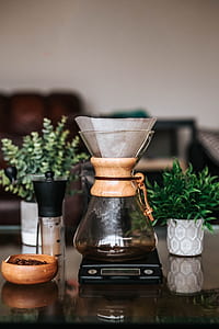clear glass bottle on top of black digital scale thumbnail