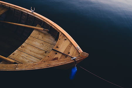 brown wooden sailing boat with paddle thumbnail