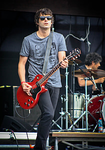 man playing guitar on stage thumbnail