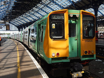 green and yellow train at daytime thumbnail