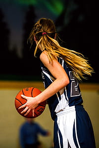 woman holding basketball thumbnail