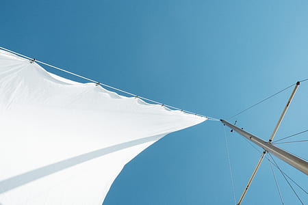long angle view of white cloth hanging on gray post thumbnail