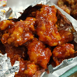 fried meat with sauce in aluminum foil thumbnail