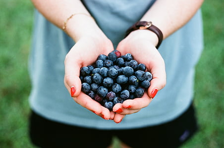 woman holding grapes thumbnail