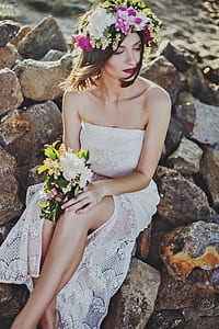 woman sitting on gray rocks thumbnail