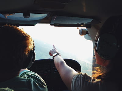 Persons on Aircraft Pointing on View during Daytime thumbnail