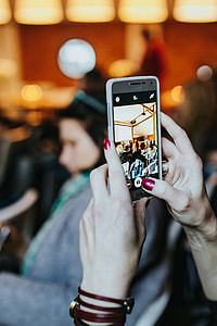 People taking photos with smartphones thumbnail