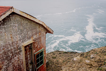brown cabin on cliff thumbnail