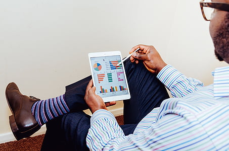man holding iPad thumbnail