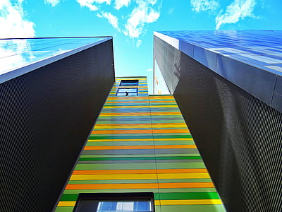 multicolored building during daytime low-angel photography thumbnail
