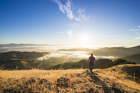 man walking on top of mountain thumbnail