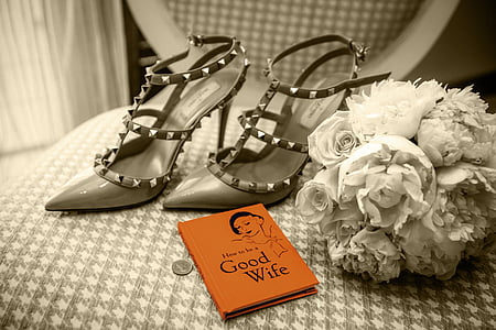 pair of women's gray pointed-toe sandals beside white flower bouquet thumbnail