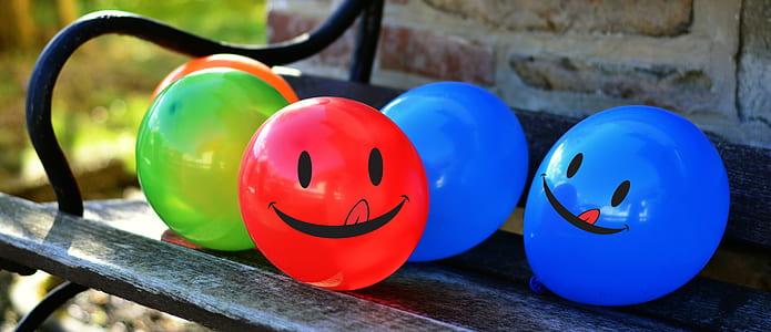 assorted balloons on patio bench thumbnail