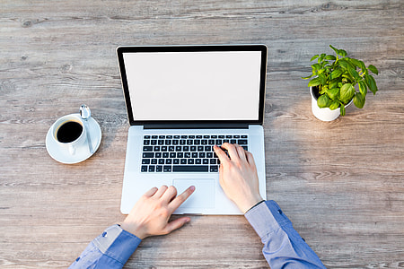 person using silver MacBook Pro thumbnail