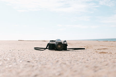 black and gray bridge camera on brown concrete pavement thumbnail