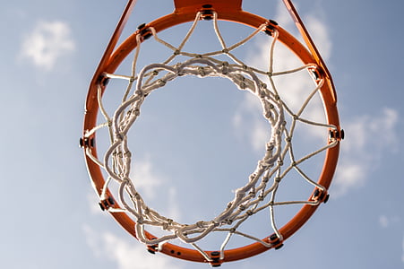 worm's eye view of red basketball ring thumbnail