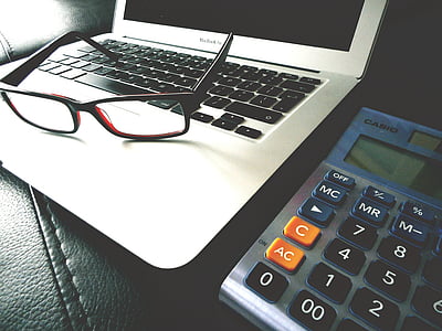 black framed eyeglasses on gray laptop thumbnail