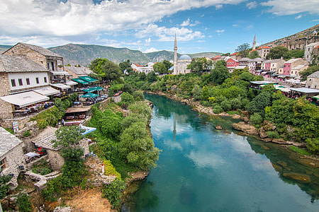 aerial photography of buildings near river at daytime thumbnail
