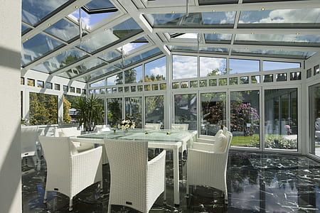 glass-top table and chars near glass wall thumbnail