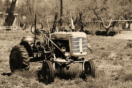 tractor on grass field during daytime thumbnail