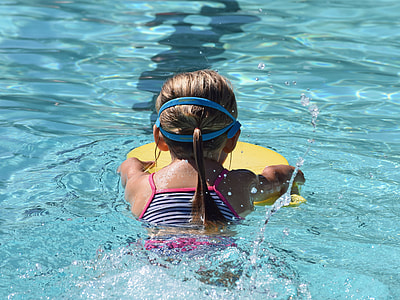 girl swimming on pool with floater thumbnail