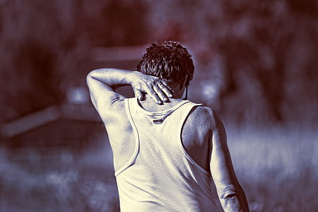 selective focus photo of man wearing black tank top thumbnail