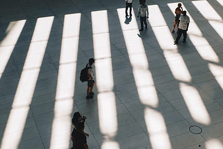 six people standing on white concrete ground thumbnail