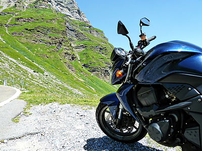 parked blue sports bike near grass thumbnail