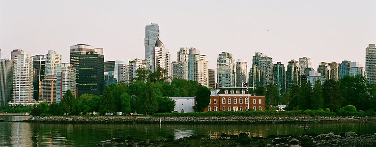 gray concrete buildings near bodies of water at daytime thumbnail