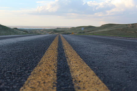 yellow lined asphalt road thumbnail