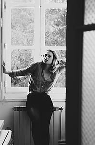 woman near the window photo thumbnail