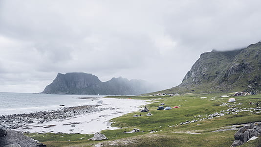 landscape photo of mountain cliff near shoreline thumbnail