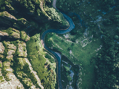 aerial photography of green grass field and road thumbnail