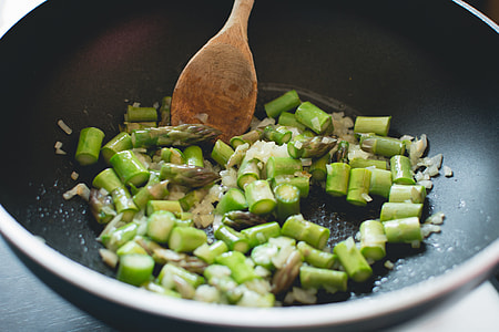 Frying asparagus with onion in a pan thumbnail