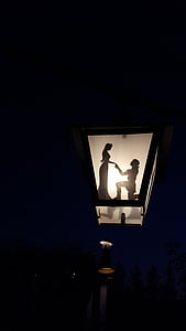 photo of black outdoor lamp with woman and man shade thumbnail