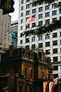 USA flag on gray pole thumbnail