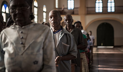 people falling in line inside churche thumbnail