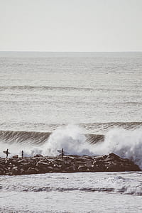 surfers on gay concrete dock thumbnail