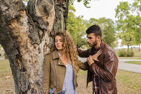 Man And Woman Wearing Brown Full-zip Jackets thumbnail