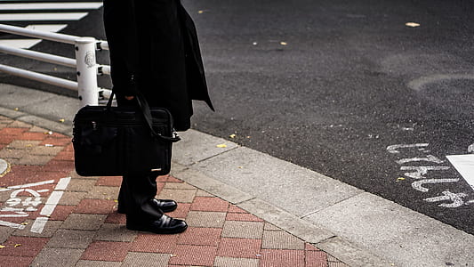 person standing beside concrete road thumbnail