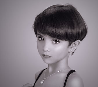grayscale photo of woman wearing black spaghetti strap top thumbnail