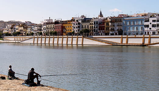 person sitting in front of the body of water thumbnail