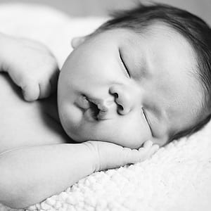grayscale photo of baby thumbnail