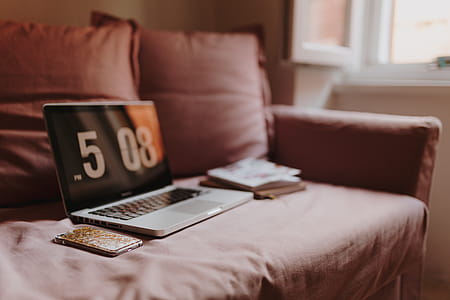 Workplace with a laptop on a pink couch thumbnail